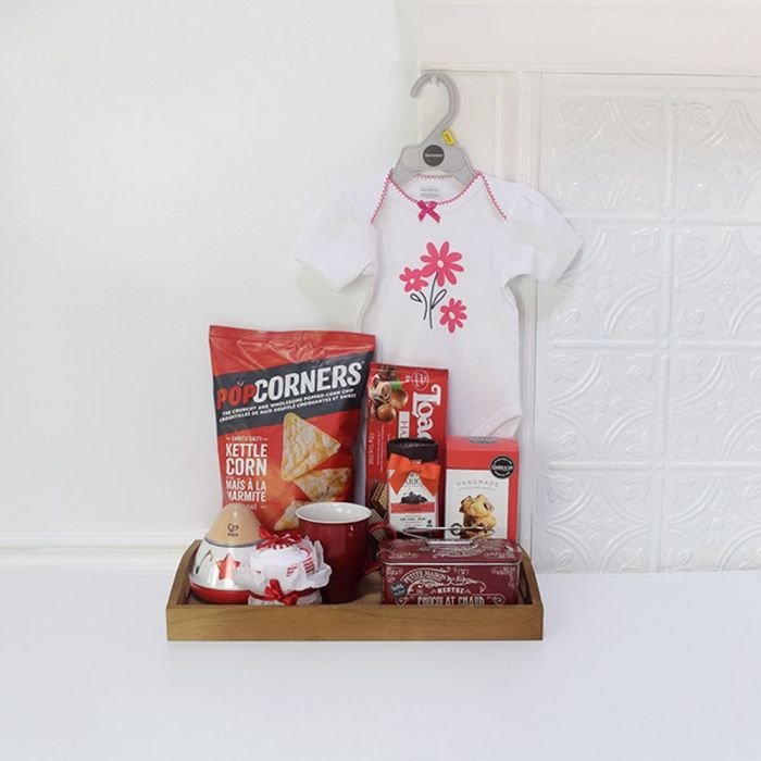 Baby Essentials and Snack Gift Basket – gift basket with dark wood tray, bold hues of fuchsia and navy